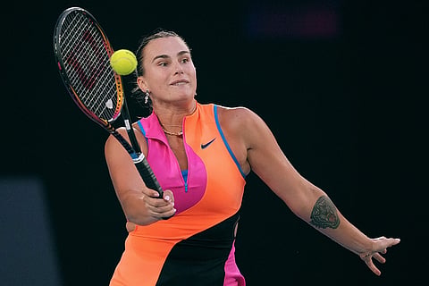 Aryna Sabalenka of Belarus plays a forehand return to Elina Svitolina of Ukraine during their semifinal match at the Australian Open tennis championship in Melbourne, Australia.