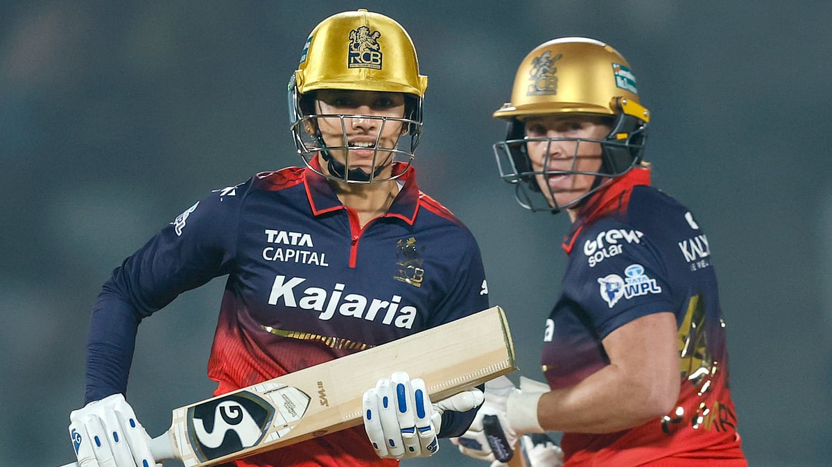 BCCI via PTI Photo : Royal Challengers Bengaluru's captain Smriti Mandhana and Grace Harris in action during their Women's Premier League 2026 match against UP Warriorz, at BCA Stadium in Vadodara.