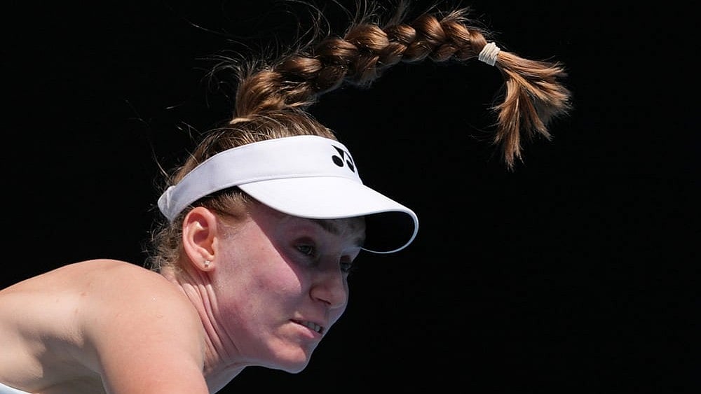 | Photo: AP/Aaron Favila : Elena Rybakina of Kazakhstan serves to Iga Swiatek of Poland during their quarterfinal match at the Australian Open tennis championship in Melbourne, Australia.