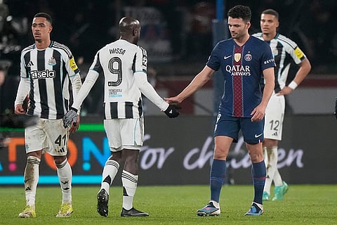 PSG's Goncalo Ramos, right, congratulates Newcastle's Yoane Wissa at the end of a Champions League opening phase soccer match between Paris Saint-Germain and Newcastle in Paris.
