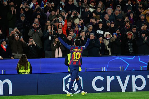 Barcelona's Lamine Yamal celebrates his side's second goal during the Champions League opening phase soccer match between Barcelona and Copenhagen in Barcelona, Spain.