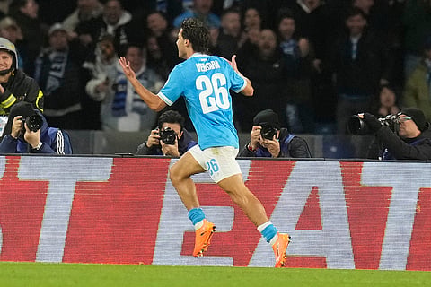 Napoli's Antonio Vergara celebrates after scoring his side's first goal during a Champions League opening phase soccer match between Napoli and Chelsea, in Naples, Italy.
