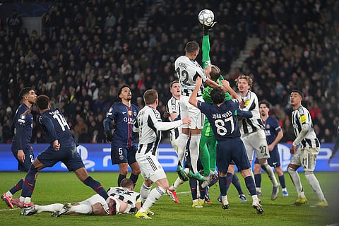 PSG's goalkeeper Matvei Safonov makes a save during a Champions League opening phase soccer match between Paris Saint-Germain and Newcastle in Paris.