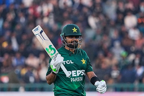 Pakistan's Babar Azam reacts as he walks off the field after his dismissal during the first T20 cricket match between Pakistan and Australia, in Lahore, Pakistan.