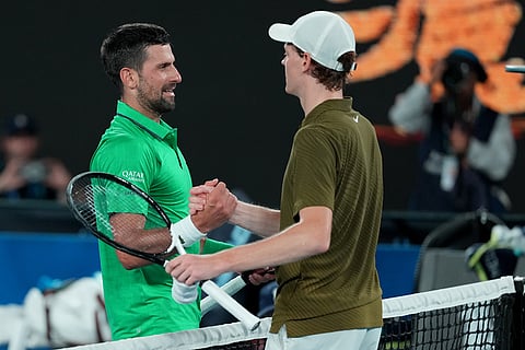Novak Djokovic, left, of Serbia is congratulated by Jannik Sinner of Italy following their semifinal match at the Australian Open tennis championship in Melbourne, Australia.