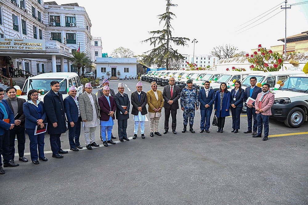 Charge d'affaires a.i. of India to Nepal Rakesh Pandey with Nepal's Finance Minister Rameshwar Prasad Khanal and other dignitaries during a ceremony to hand over more than 250 SUVs and double-cab pickup vehicles as the second consignment of election-related assistance from India to Nepal.  - | Photo: @IndiaInNepal/X via PTI 
