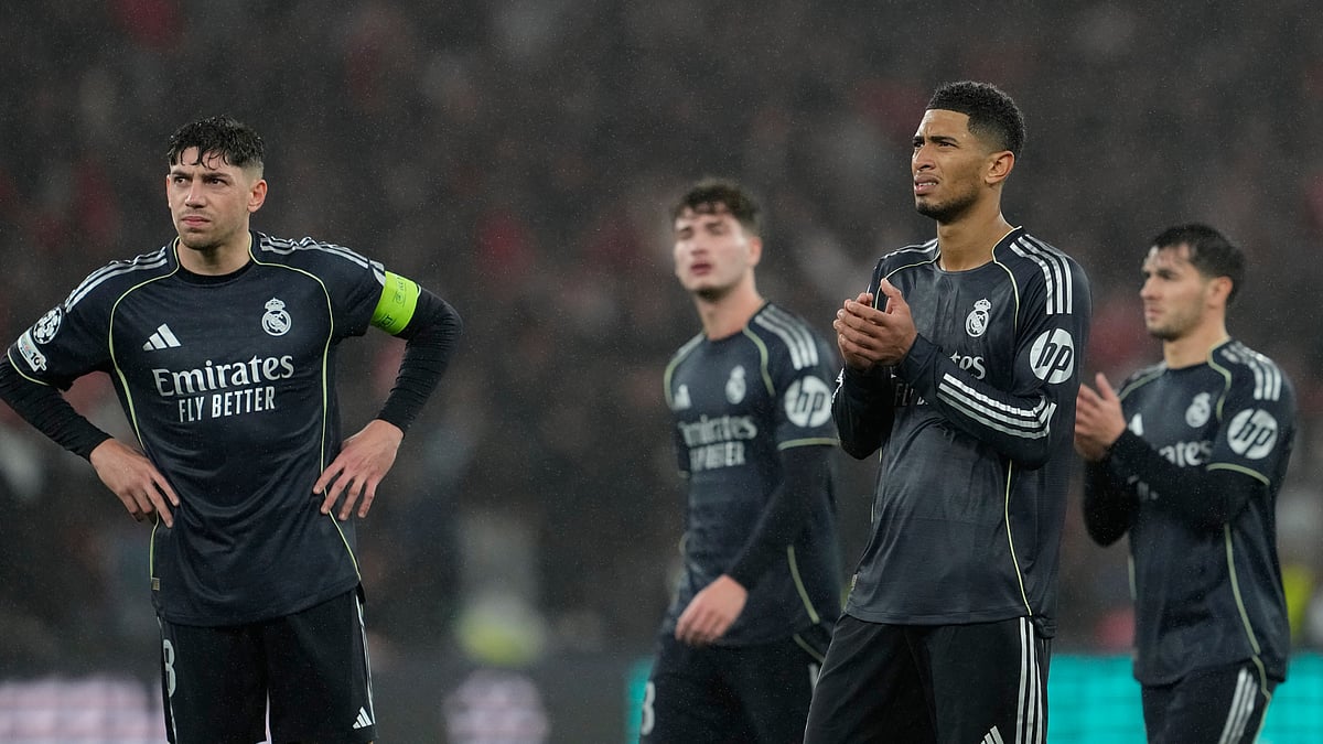 | Photo: AP/Armando Franca : Real Madrid players gesture towards supporters at the end of a Champions League opening phase soccer match between Benfica and Real Madrid, in Lisbon, Wednesday, Jan. 28, 2026.
