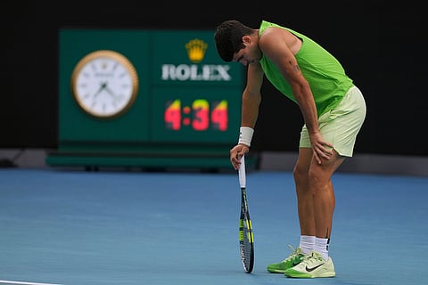 Carlos Alcaraz of Spain reacts during his semifinal match against Alexander Zverev of Germany at the Australian Open tennis championship in Melbourne, Australia.