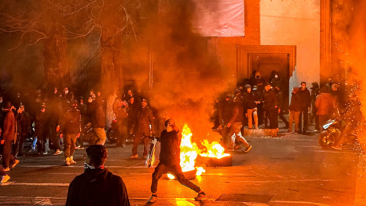 |Source: IMAGO / Middle East Images : Iranians gather while blocking a street during a protest in Tehran, Iran on January 9, 2026. The nationwide protests started in Tehran's Grand Bazaar against the failing economic policies in late December, which spread to universities and other cities, and included economic slogans, to political and anti-government ones