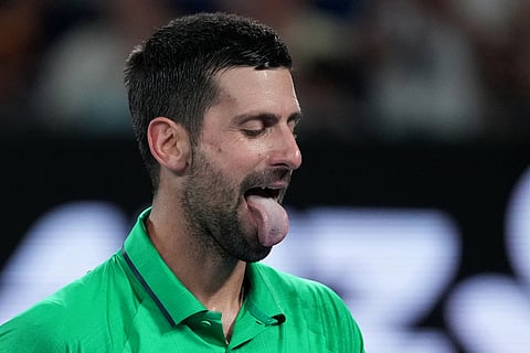 Novak Djokovic of Serbia reacts during his semifinal match against Jannik Sinner of Italy at the Australian Open tennis championship in Melbourne, Australia.