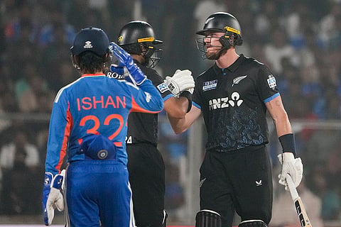 New Zealand's Finn Allen, right, celebrates his half century with Rachin Ravindra, back left, during the fifth and final T201 cricket match between India and New Zealand, at the Greenfield International Stadium, in Thiruvananthapuram, Kerala.