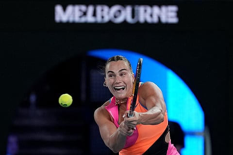 Aryna Sabalenka of Belarus plays a backhand return to Elena Rybakina of Kazakhstan during the women's singles final at the Australian Open tennis championship in Melbourne, Australia.