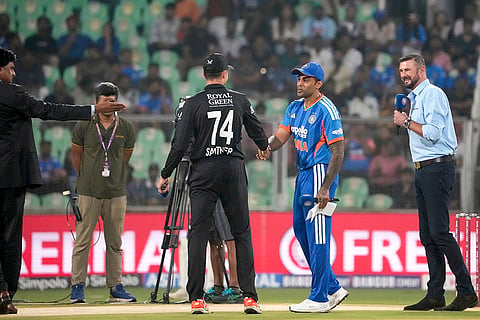 India's Suryakumar Yadav, second right, and New Zealand's Mitchell Santner, centre, during toss before the fifth and final T20 International cricket match between India and New Zealand, at the Greenfield International Stadium, in Thiruvananthapuram, Kerala.