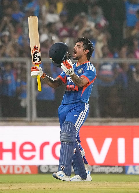 India's Ishan Kishan celebrates his century during the fifth and final T20 International cricket match between India and New Zealand, at the Greenfield International Stadium, in Thiruvananthapuram.