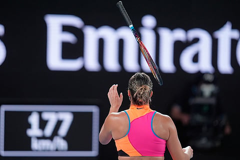 Aryna Sabalenka of Belarus tosses her racket after losing her serve to Elena Rybakina of Kazakhstan during the women's singles final at the Australian Open tennis championship in Melbourne, Australia.