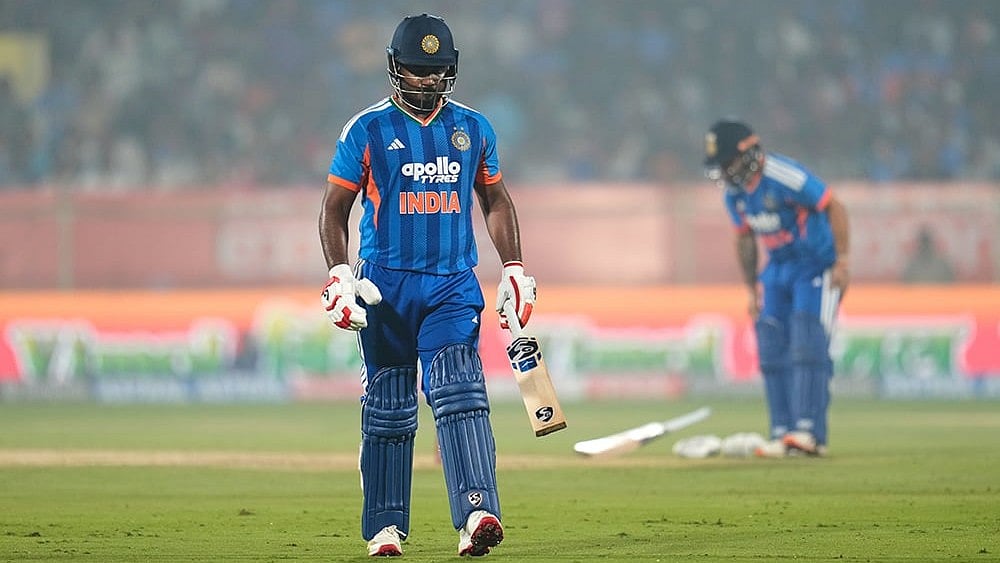 | Photo: AP/Aijaz Rahi : India's Sanju Samson walks off the field after losing his wicket during the fourth T20 cricket match between India and New Zealand in Visakhapatnam.