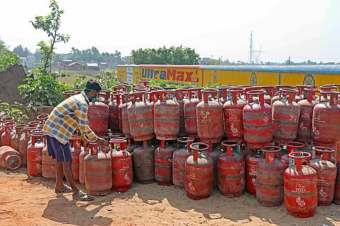 A worker arranges LPG cylinders, ahead of the presentation of the Union Budget 2026-27 by Union Finance Minister Nirmala Sitharaman, in Birbhum, West Bengal.