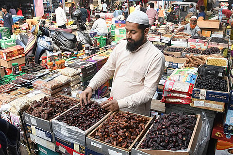 A vendor sells dry fruits, ahead of the presentation of the Union Budget 2026-27 by Union Finance Minister Nirmala Sitharaman, in Guwahati, Assam.