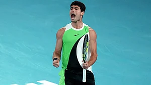 (AP Photo/Mark Baker) : Carlos Alcaraz of Spain reacts during the men's singles final match against Novak Djokovic of Serbia at the Australian Open tennis championship in Melbourne, Australia, Sunday, Feb. 1, 2026