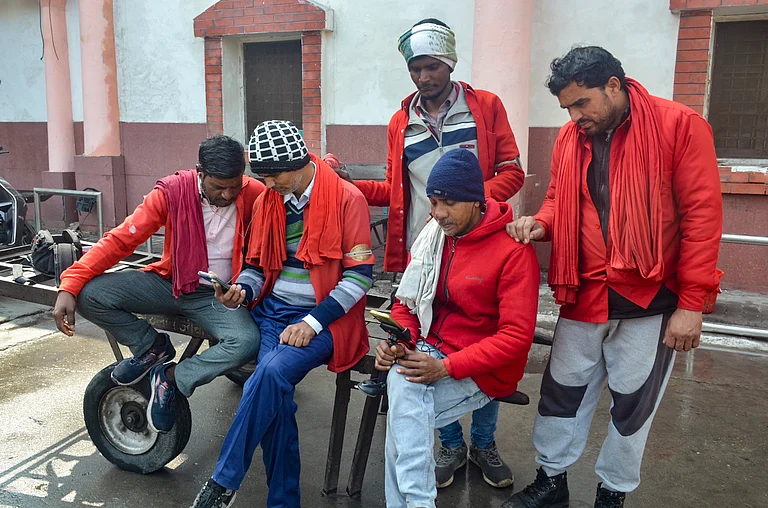People listen to the Union Budget 2026-27 presented by Finance Minister Nirmala Sitharaman, virtually, in Moradabad, Uttar Pradesh, Sunday, Feb. 1, 2026. - PTI