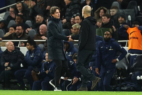 Tottenham's head coach Thomas Frank, left, and Manchester City's head coach Pep Guardiola shake hands after the English Premier League soccer match between Tottenham Hotspur and Manchester City in London.