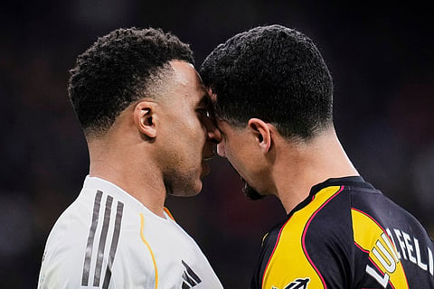 Real Madrid's Kylian Mbappe, left, argues with Rayo's Luiz Felipe during the Spanish La Liga soccer match between Real Madrid and Rayo Vallecano in Madrid, Spain.