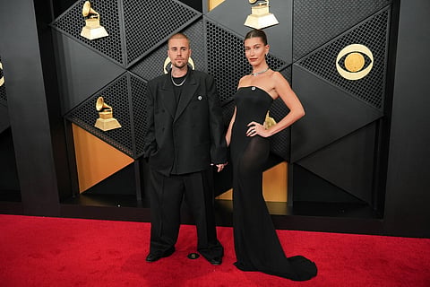 Justin Bieber, left, and Hailey Bieber arrive at the 68th annual Grammy Awards on Sunday, Feb. 1, 2026, in Los Angeles.