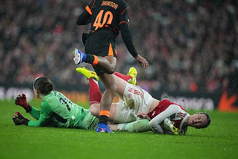 Arsenal's Lotte Wubben-Moy, right, collides with Arsenal's goalkeeper Anneke Borbe during the Women's Champions Cup final soccer match between Arsenal FC and SC Corinthians in London.