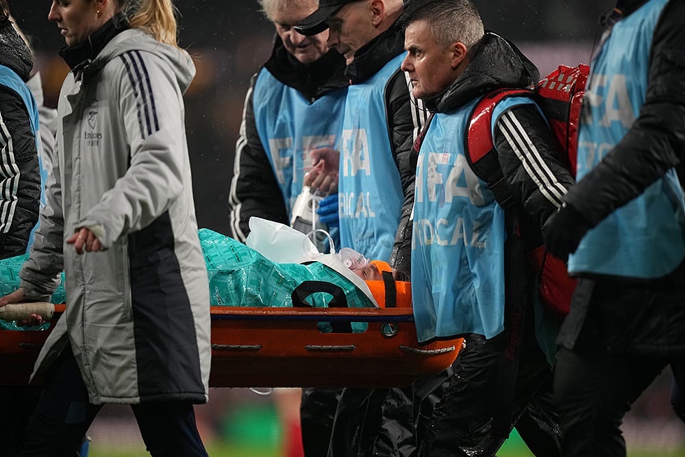 | Photo: AP/Alastair Grant : Arsenal's goalkeeper Anneke Borbe is carried on a stretcher after getting injured in a collision with teammate Lotte Wubben-Moy during the Women's Champions Cup final soccer match between Arsenal FC and SC Corinthians in London.
