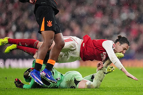 Arsenal's Lotte Wubben-Moy, top, collides with Arsenal's goalkeeper Anneke Borbe during the Women's Champions Cup final soccer match between Arsenal FC and SC Corinthians in London.