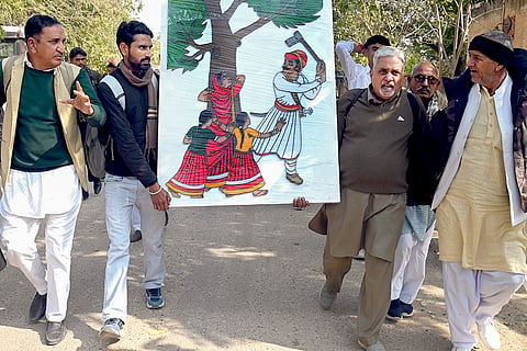 Environmental activists and members of the Bishnoi community take part in the 'Save Khejri Movement', protesting against the proposed cutting of Khejri trees for a solar power plant, in Bikaner.