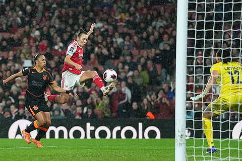Arsenal's Caitlin Foord, center, attempts a shot at goal during the Women's Champions Cup final soccer match between Arsenal FC and SC Corinthians in London.