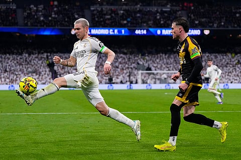 Real Madrid's Franco Mastantuono controls the ball during the Spanish La Liga soccer match between Real Madrid and Rayo Vallecano in Madrid, Spain.