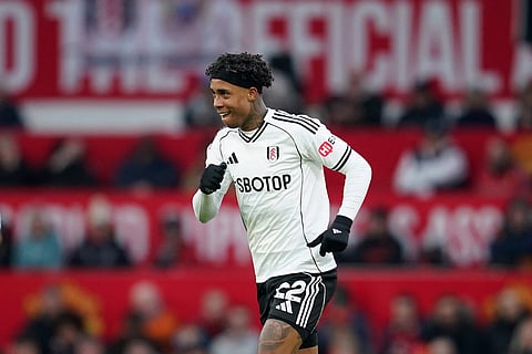 Fulham's Kevin celebrates after scoring his side's second goal during the English Premier League soccer match between Manchester United and Fulham in Manchester, England.