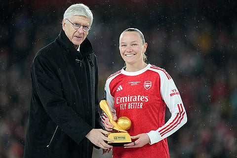 Arsenal's Frida Maanum receives the Best Player award from Arsene Wenger, FIFA's Chief of Global Football Development, at the the end of the Women's Champions Cup final soccer match between Arsenal FC and SC Corinthians in London.