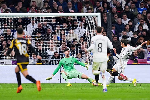 Real Madrid's goalkeeper Thibaut Courtois saves a ball during the Spanish La Liga soccer match between Real Madrid and Rayo Vallecano in Madrid, Spain.
