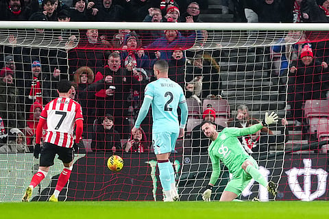 Burnley goalkeeper Martin Dubravka, right, fails to block a goal by Sunderland during a Premier League soccer match in Sunderland.
