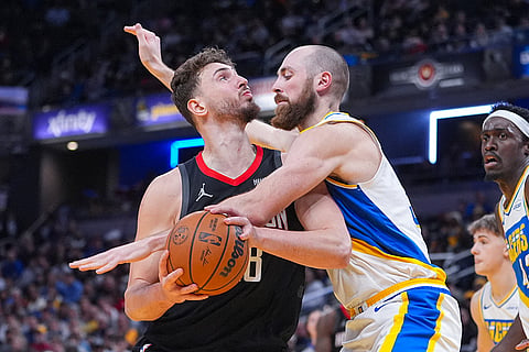Indiana Pacers center Jay Huff (32) fouls Houston Rockets center Alperen Sengun (28) during the second half of an NBA basketball game in Indianapolis.