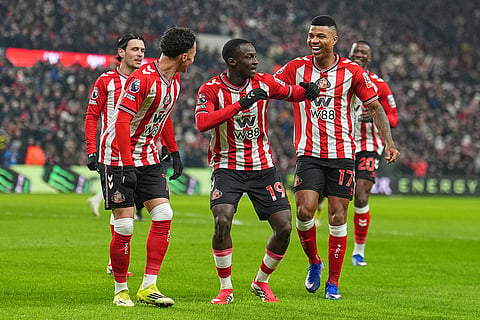 Sunderland's Habib Diarra celebrates with teammates after scoring a goal during a Premier League soccer match against Burnley at the Stadium of Light in Sunderland.