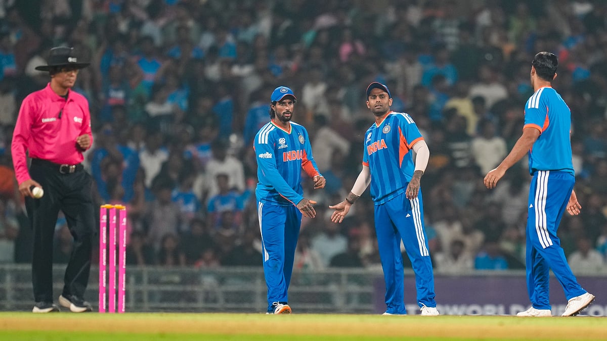 Photo: PTI : India's captain Suryakumar Yadav, centre, with teammates Tilak Varma, left, and Shivam Dube celebrates the wicket of South Africa's Dewald Brevis during their ICC Men's T20 World Cup warm-up match at the DY Patil Sports Academy in Navi Mumbai.