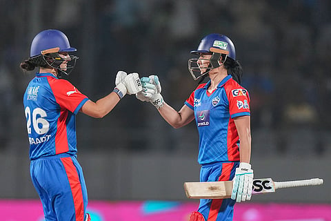 Delhi Capitals' Marizanne Kapp, right, with teammate Laura Wolvaardt during the Women's Premier League (WPL) 2026 eliminator T20 cricket match between Gujarat Giants and Delhi Capitals, in Vadodara, Gujarat.