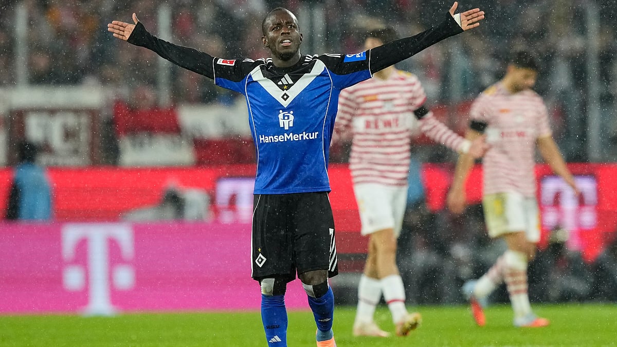| Photo: AP/Martin Meissner : Hamburg's Jean-Luc Dompe reacts during the German Bundesliga soccer match between Cologne and Hamburger SV, in Cologne, Germany, Sunday, Nov. 2, 2025.