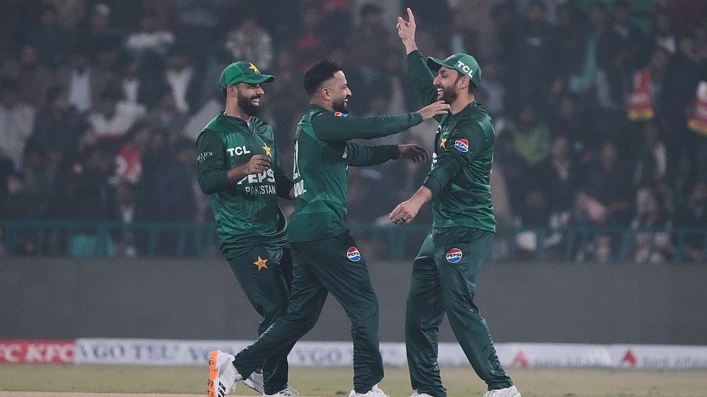 Photo: AP : Pakistan's Mohammad Nawaz, centre, celebrates with teammates after taking the wicket of Australia's Cameron Green during the third T20I in Lahore.