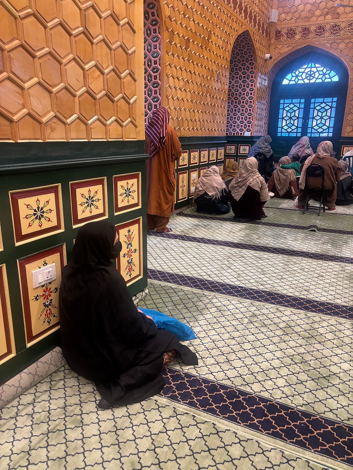 Fozia Yasin : A woman coping with anxiety sits inside the Dastgeer Sahib Shrine in Khanyar, Srinagar.