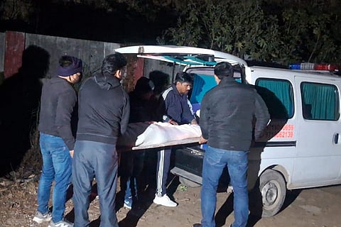 Mortal remains of the three minor sisters, who died after allegedly jumping off the balcony of their ninth floor home, being carried after post-mortem procedure, in Ghaziabad. The minors were allegedly addicted to an online Korean game that involved a series of tasks, according to sources. 