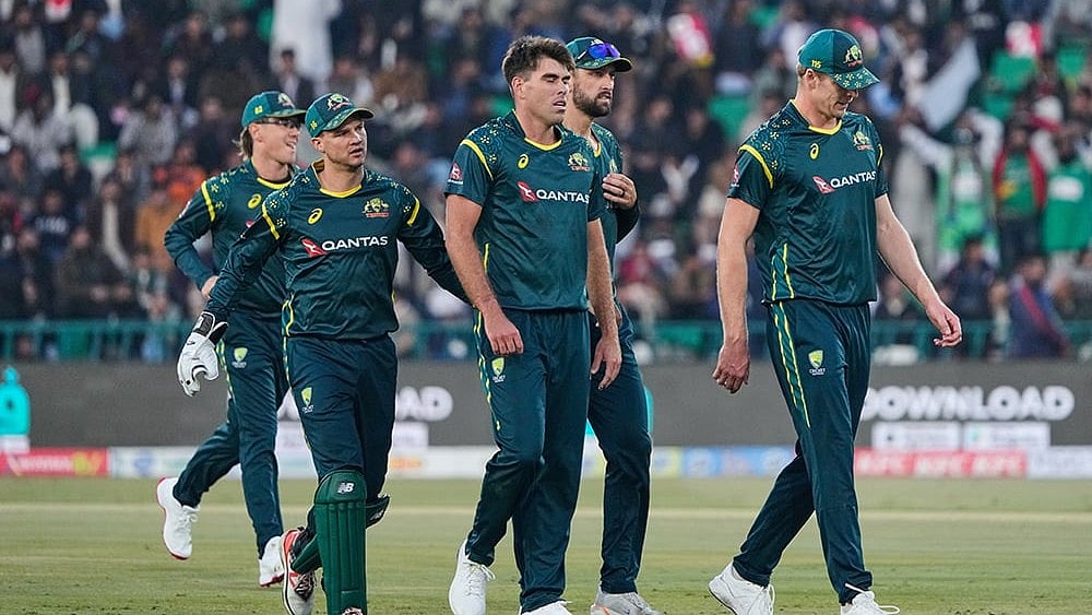 | Photo: AP/K.M. Chaudary : Australia's Xavier Bartlett, center, celebrates with teammates after the dismissal of Pakistan's Fakhar Zaman during the first T20 cricket match between Pakistan and Australia, in Lahore, Pakistan.
