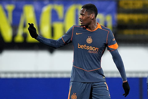 Inter Milan's Ange-Yoan Bonny celebrates after scoring against Torino during an Italian Cup soccer match in Monza, Italy.