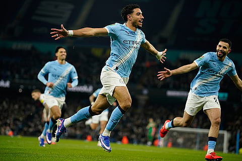 Manchester City's Omar Marmoush celebrates after scoring during the English League Cup semifinal soccer match soccer match between Manchester City and Newcastle in Manchester, England.
