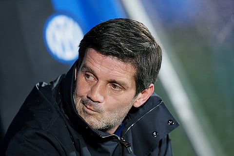 Inter Milan's head coach Cristian Chivu sits on the bench during an Italian Cup soccer match against Torino in Monza, Italy.