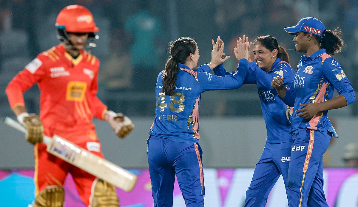 PTI : Mumbai Indians' Amelia Kerr, back left, celebrates with captain Harmanpreet Kaur, back centre, and Hayley Matthews, right, after taking the wicket of Gujarat Giants captain Anushka Sharma during a Women's Premier League (WPL) 2026 